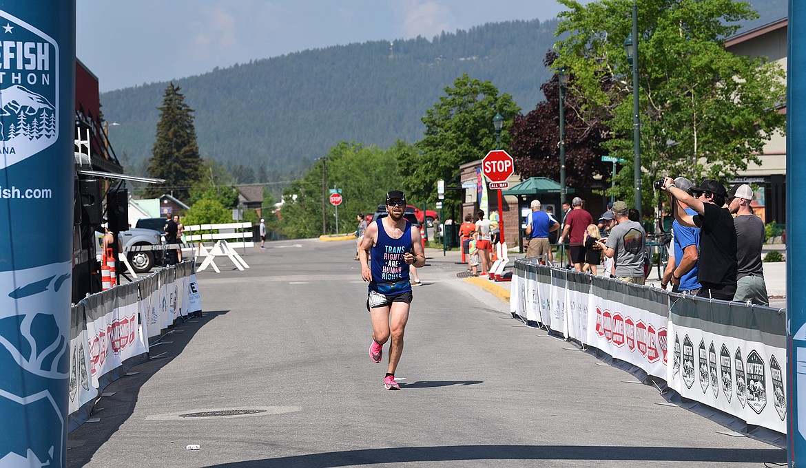 Ryan Wilbur of Kalispell crosses the finish line of the Whitefish Marathon in second place overall on Saturday. (Julie Engler/Whitefish Pilot)