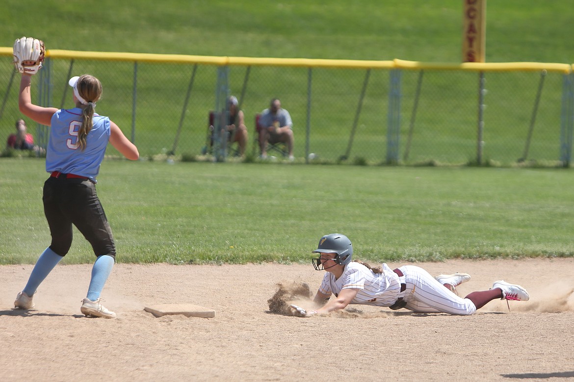 Moses Lake senior Ali Stanley, right, slides into second base during the top of the seventh inning against Eastmont on Saturday.