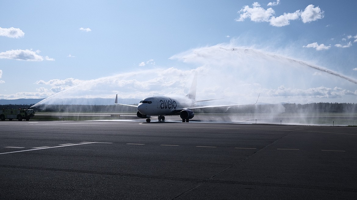 The inaugural Avelo Airlines flight from Burbank, California taxis under a celebratory water arch at Glacier Park International Airport outside of Kalispell, Montana on Monday May 22, 2023. (Adrian Knowler/Daily Inter Lake)