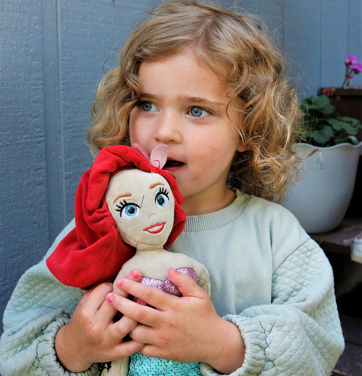 Camila Clark holds Ariel outside their Coeur d'Alene home on Monday.