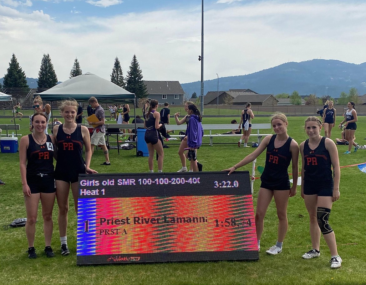 The Priest River girls 800-meter sprint medley relay poses for a photo with their winning time at the District 1 Meet of Champions earlier this season