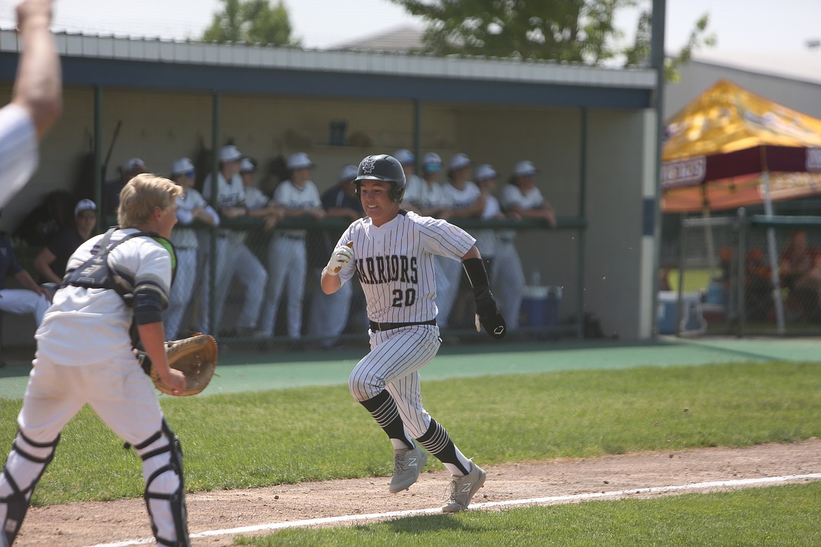 ACH sophomore Grayson Beal sprints home to score on a sacrifice fly in the bottom of the third inning against Naselle.