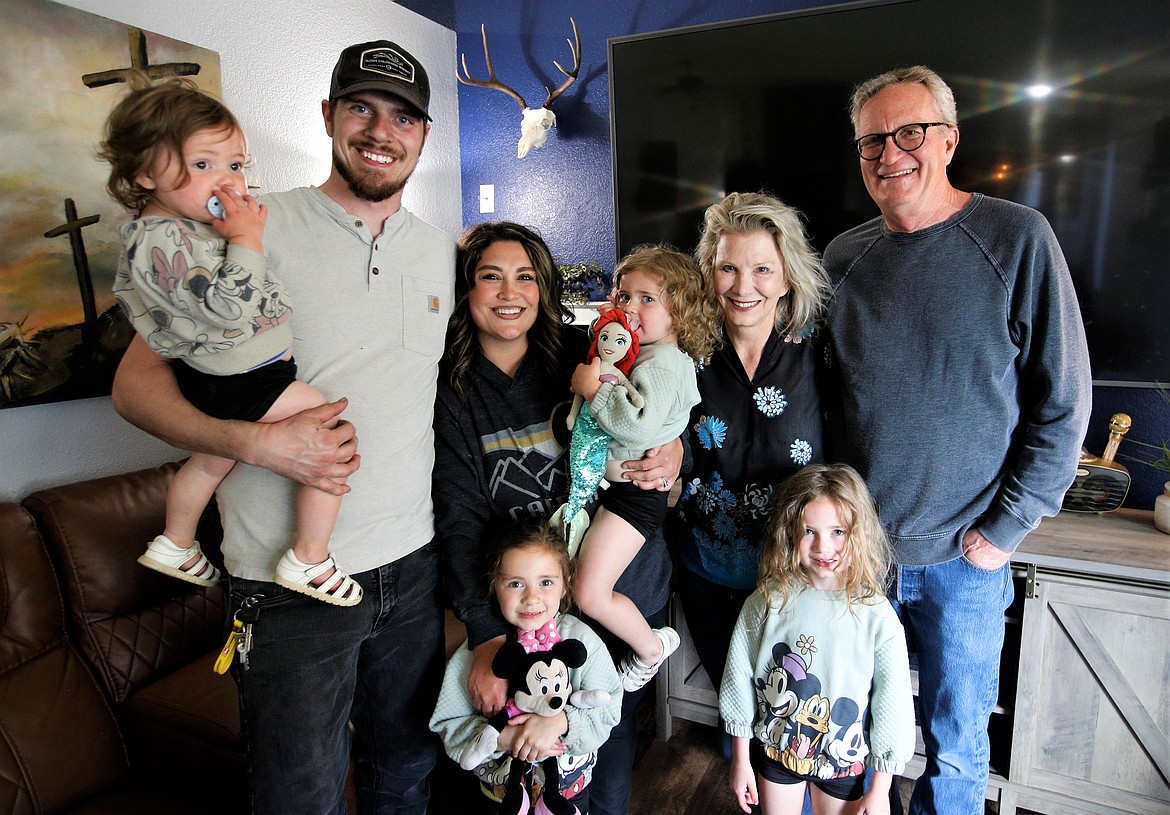 The Ariel doll is back home in Coeur d'Alene with the Clark family. Back row, from left, Cody Clark holding Charlotte, Cortney Clark holding Camila, Karren Williams and Lenny Hess. Front from left, Cayden and Caroline Clark.