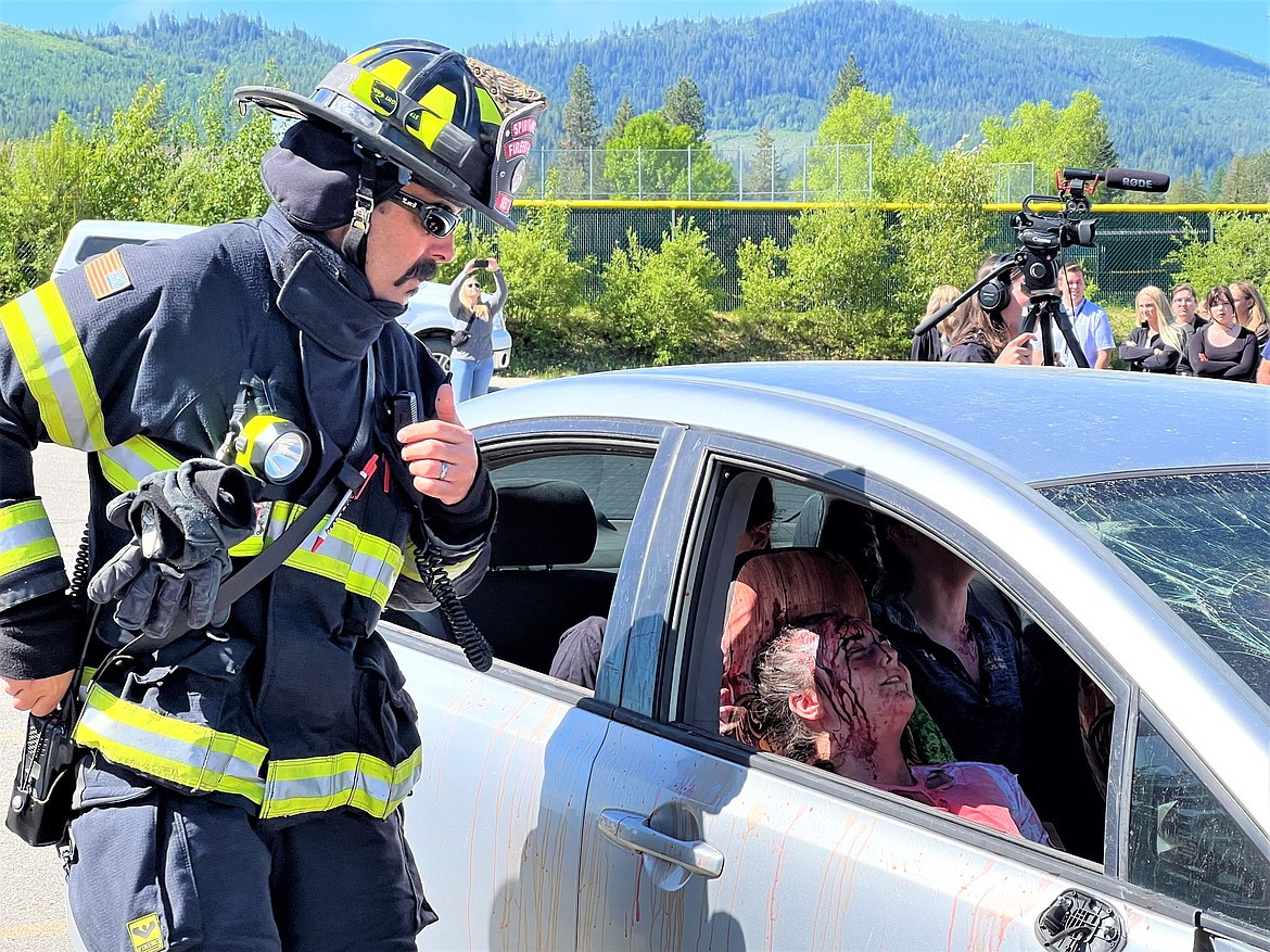 Photo by Chris Jarstad
A first responder checks on victims in a mock DUI crash on Tuesday at Timberlake High School.