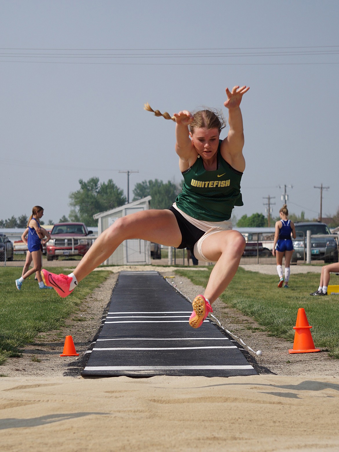 Junior Bailey Smith jumps for a season best 15-07.00 in the women’s varsity long jump competition on Friday. (Matt Weller photo)