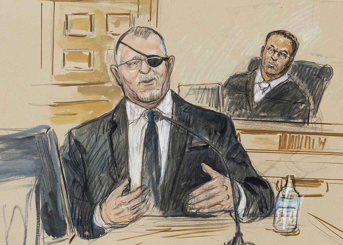 This artist sketch depicts the trial of Oath Keepers leader Stewart Rhodes, left, as he testifies before U.S. District Judge Amit Mehta on charges of seditious conspiracy in the Jan. 6, 2021, attack on the U.S. Capitol, in Washington, Nov. 7, 2022. Rhodes and members of his antigovernment group will be the first Jan. 6 defendants sentenced for seditious conspiracy in a series of hearings beginning this week that will set the standard for more punishments of far-right extremists to follow. (Dana Verkouteren via AP, File)