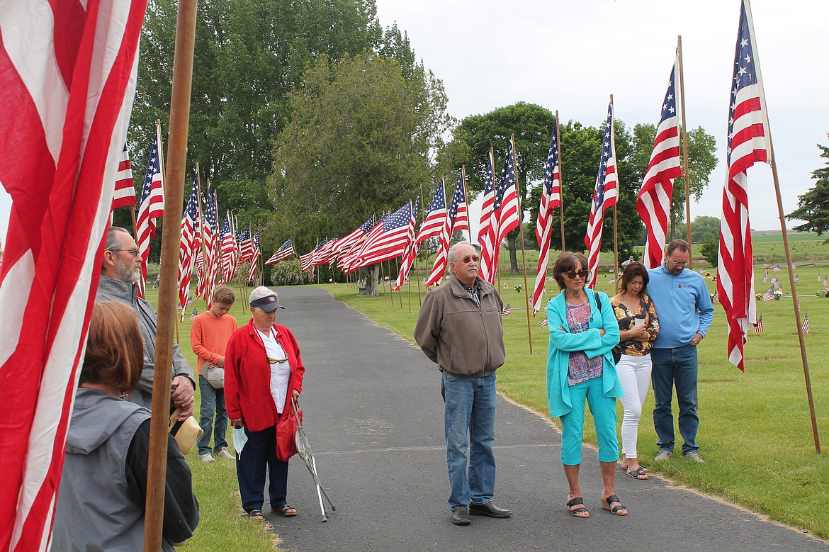 Attendees listen to a speaker at a Memorial Day ceremony at Pioneer Memorial Gardens in Moses Lake. The cemetery will host the 2023 remembrance Monday.