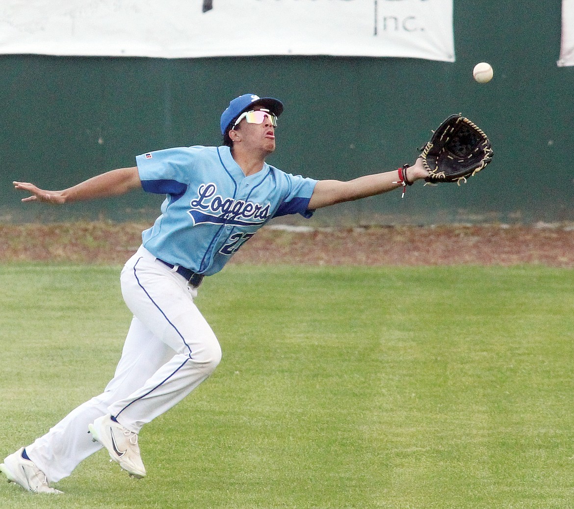 A nice running catch is made by Libby right fielder Amir Clutter as Kalispell's Luke Nikunen flies out on the 1-2 pitch for the second out in the top of third inning Wednesday evening. (Paul Sievers/The Western News)