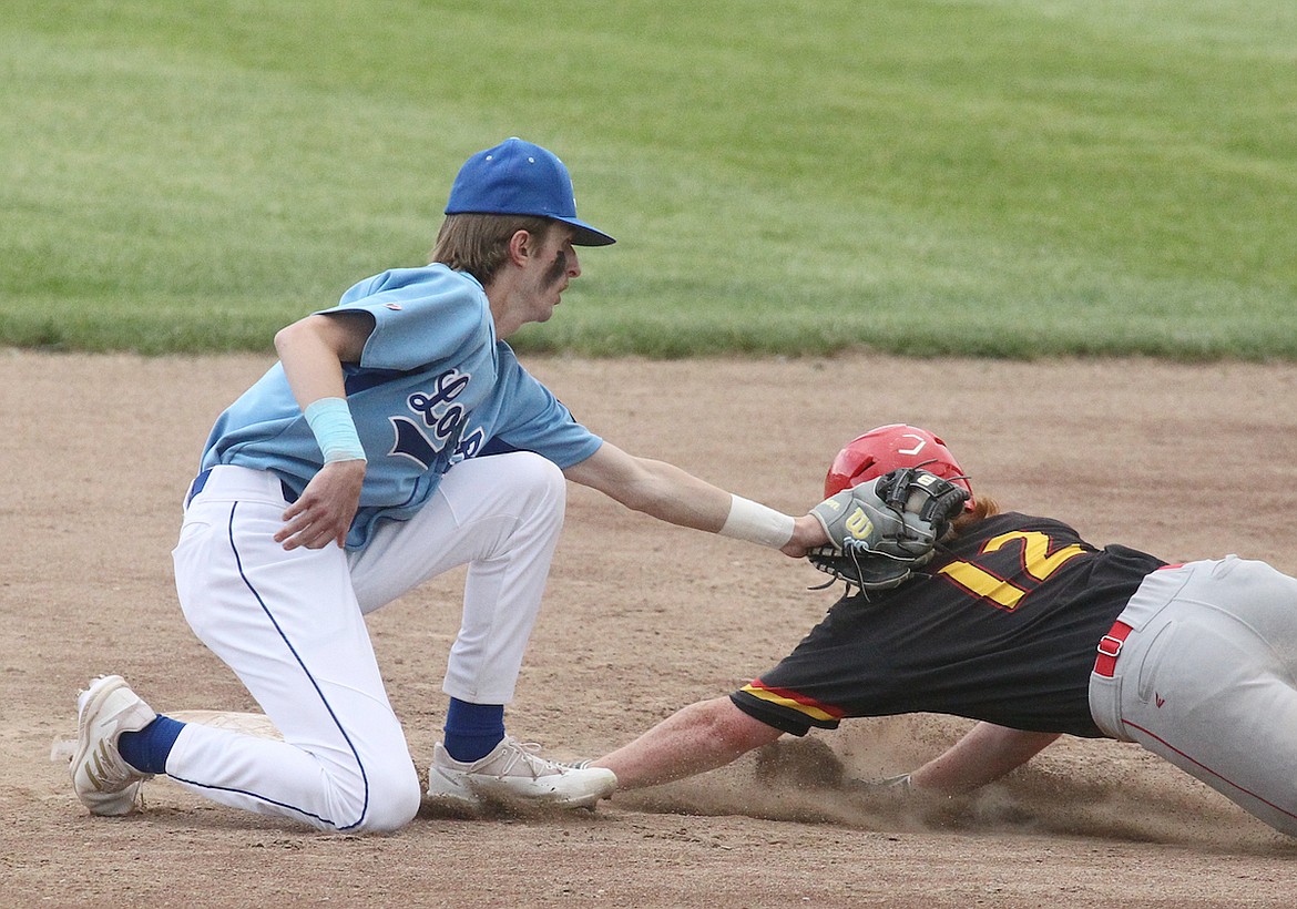 Libby's Dylan Buckner puts the tag on a Lakers runner as he tries to steal for the first out in the top of third inning Wednesday evening at Lee Gehring Field. (Paul Sievers/The Western News)