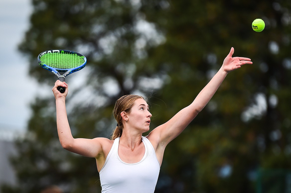 Glacier's Colette Daniels serves in a girls doubles match with teammate Katy Bitney against Sentinel's Hannah Kidd and Marin Meyer during the State AA tennis tournament at FVCC on Thursday, May 25. (Casey Kreider/Daily Inter Lake)