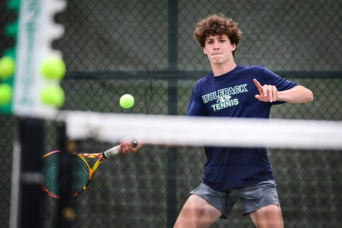 Glacier's Will Rudbach hits a return in a boys singles match against Gallatin's Mason McCarty during the State AA tennis tournament at FVCC on Thursday, May 25. (Casey Kreider/Daily Inter Lake)