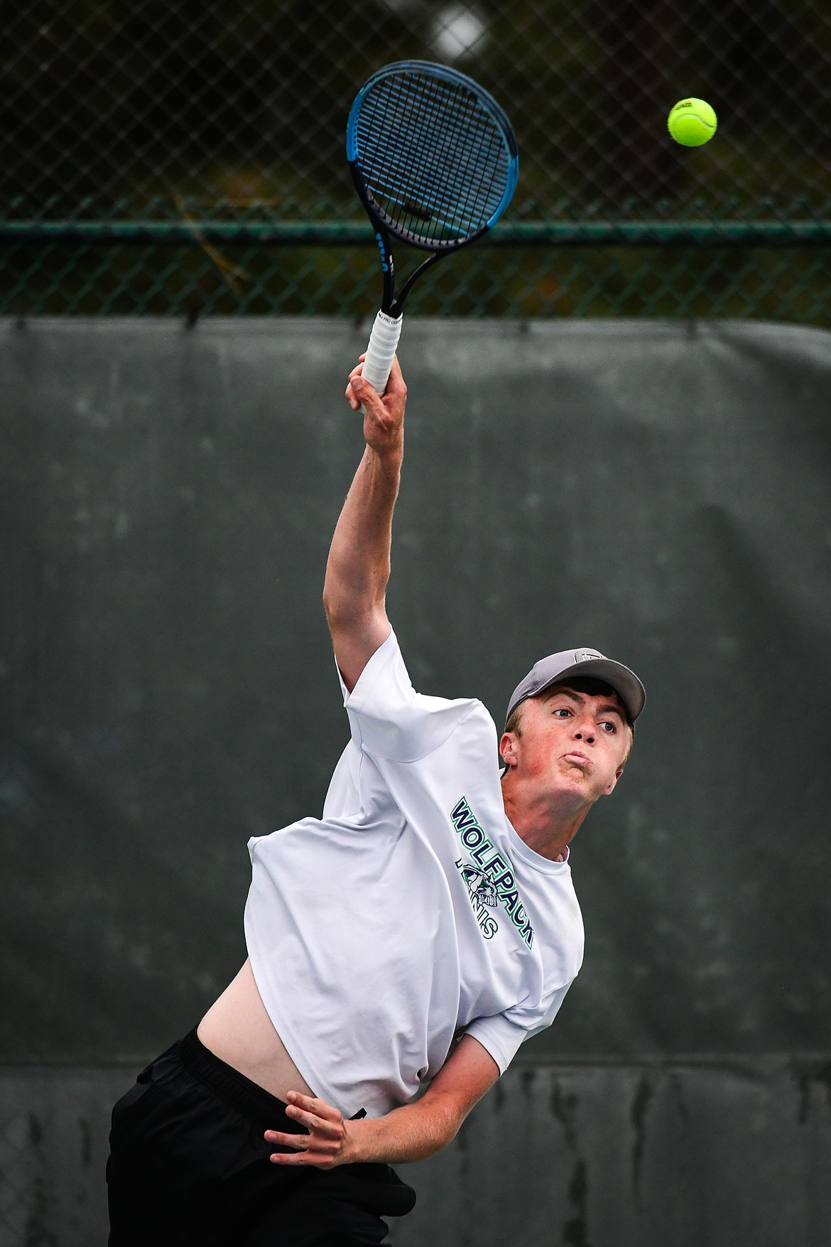 Glacier's Trey Engellant serves in a boys doubles match with teammate Ethan Woods against Sentinel's Noah Nelson and Jamie Navarro during the State AA tennis tournament at FVCC on Thursday, May 25. (Casey Kreider/Daily Inter Lake)