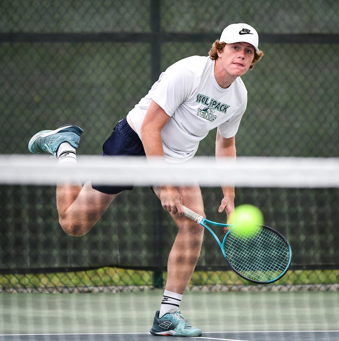 Glacier's Timmy Glanville serves in a boys doubles match with teammate Harrison Sanders against Hellgate's Manta O'Neill and Nikko Kujawa during the State AA tennis tournament at FVCC on Thursday, May 25. (Casey Kreider/Daily Inter Lake)