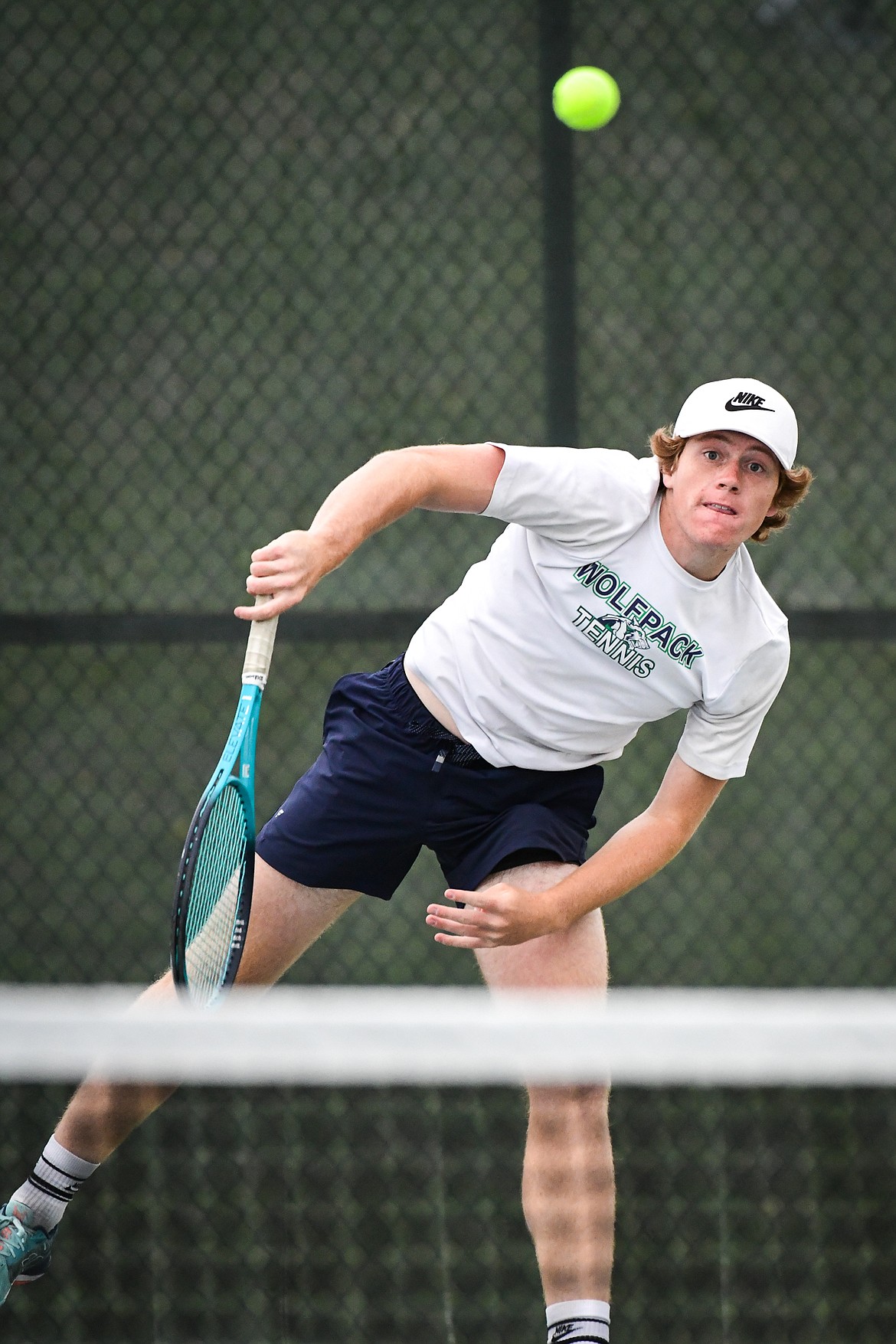 Glacier's Timmy Glanville serves in a boys doubles match with teammate Harrison Sanders against Hellgate's Manta O'Neill and Nikko Kujawa during the State AA tennis tournament at FVCC on Thursday, May 25. (Casey Kreider/Daily Inter Lake)