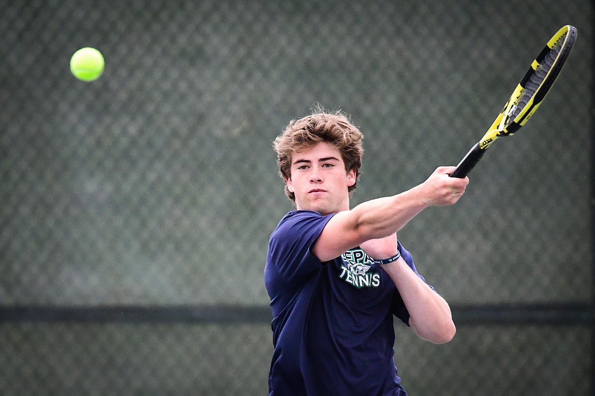 Glacier's Harrison Sanders hits a return in a boys doubles match with teammate Timmy Glanville against Hellgate's Manta O'Neill and Nikko Kujawa during the State AA tennis tournament at FVCC on Thursday, May 25. (Casey Kreider/Daily Inter Lake)