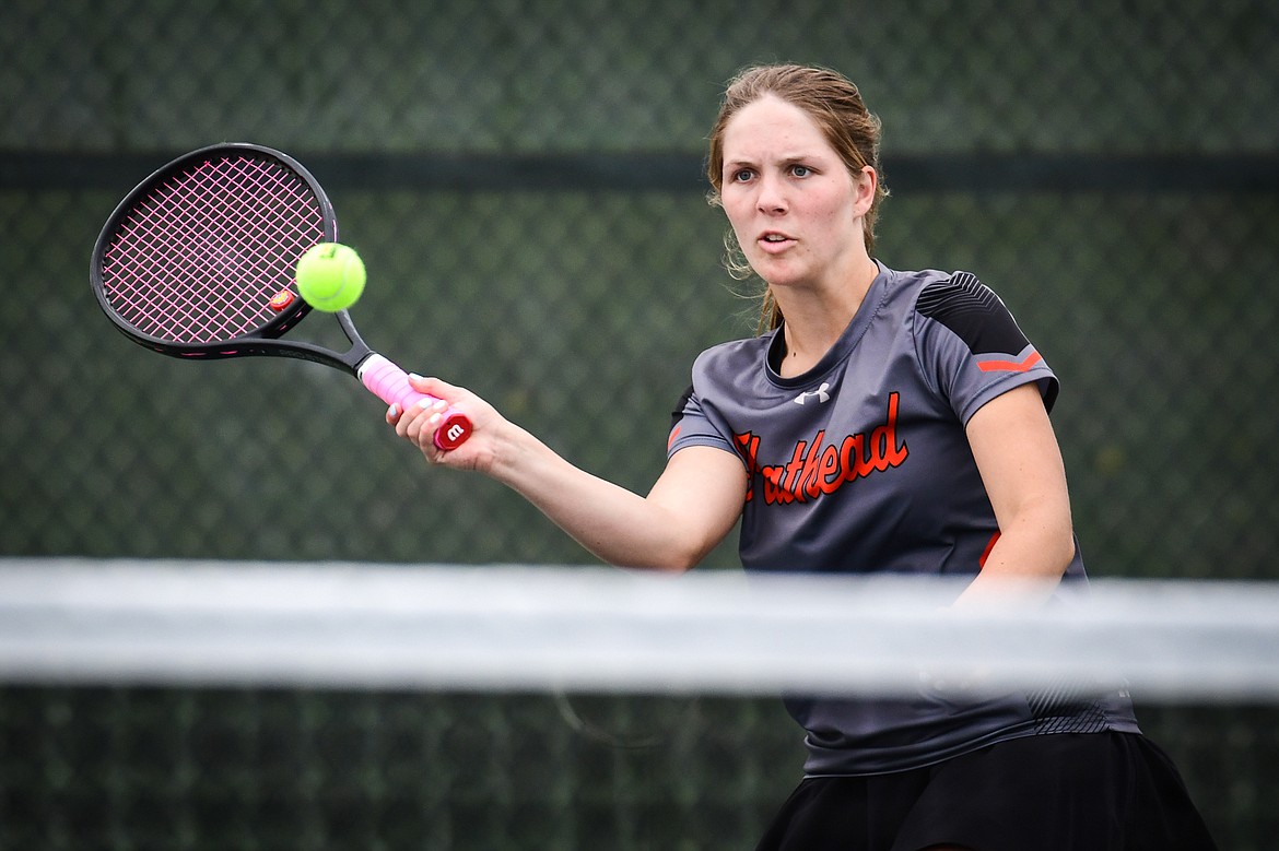 Flathead's Isabella Parrott hits a return in a girls singles match against Bozeman's Ava Couture during the State AA tennis tournament at FVCC on Thursday, May 25. (Casey Kreider/Daily Inter Lake)