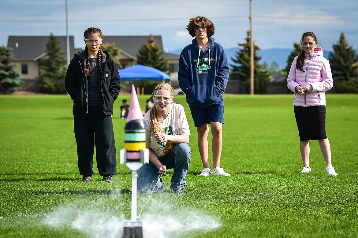 The Hummingbees from Helena Flats School, from left, Naomi Saito, Aubrey Nelson, Kiernan Rourke Kelly and Talia Korchman launch their water-powered rocket   at the Flathead Valley Rocket Rally outside Glacier High School on Thursday, May 25 (Casey Kreider/Daily Inter Lake)