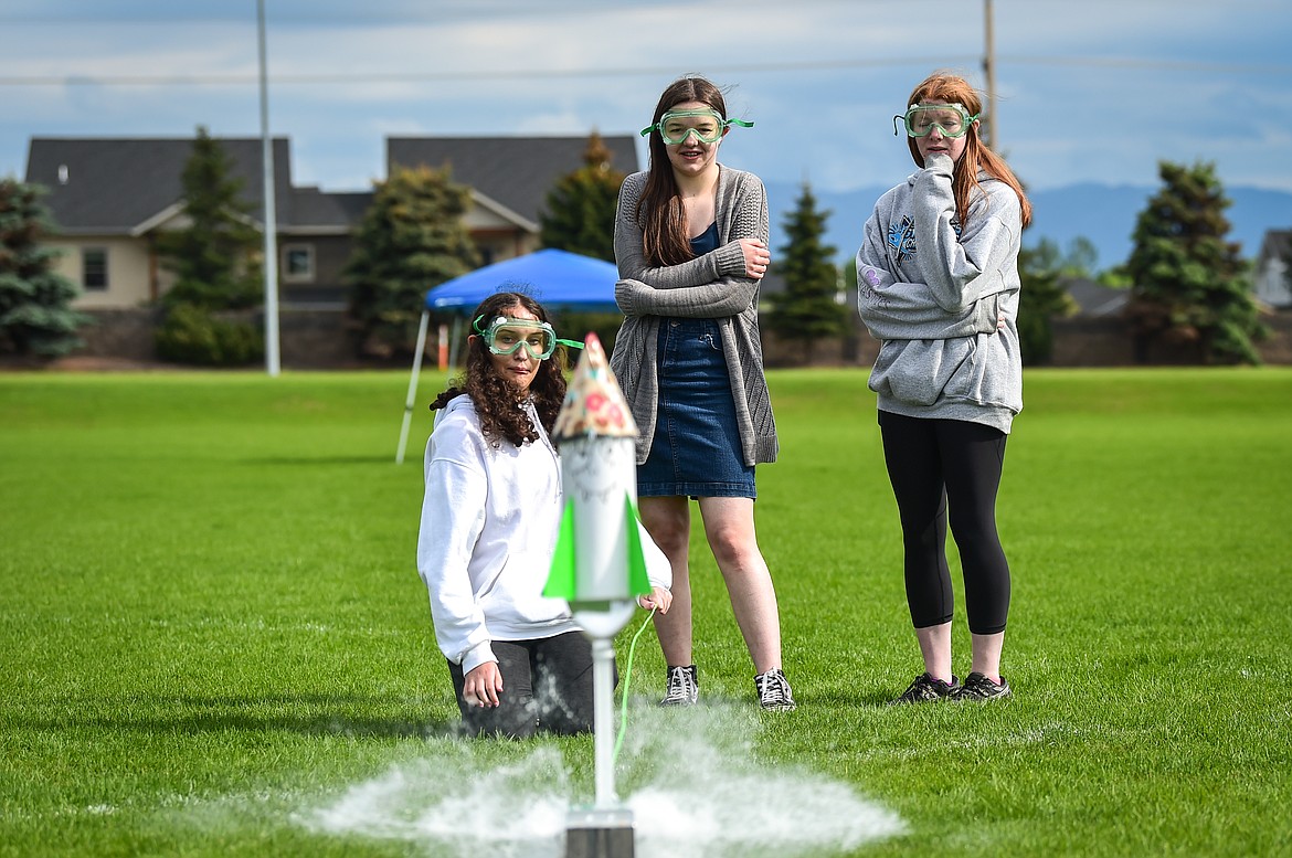 Team Shrek from Evergreen Junior High, from left, Aubrey Reed, Alivia Jarman and Ella Goodwin launch their water-powered rocket at the Flathead Valley Rocket Rally outside Glacier High School on Thursday, May 25 (Casey Kreider/Daily Inter Lake)