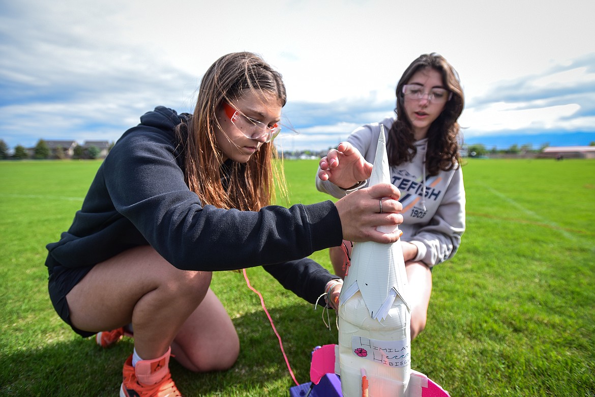 The Himalayan Hibiscus team of Zoe Winter and Leilani Lennarz from West Valley School, get their rocket ready for  launch at the Flathead Valley Rocket Rally outside Glacier High School on Thursday, May 25 (Casey Kreider/Daily Inter Lake)