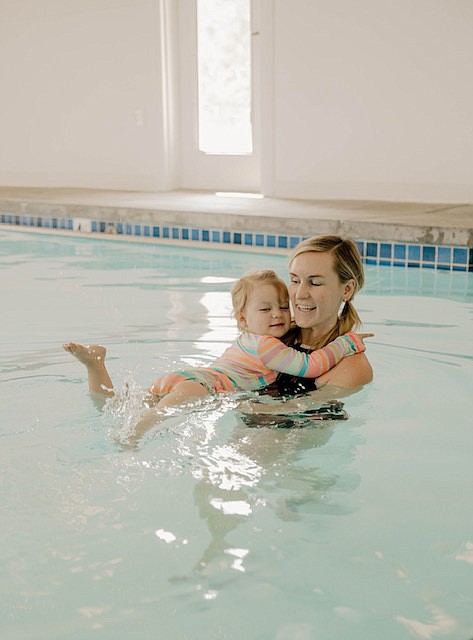 Chelsea Cates, owner and private swim instructor of Float Swim Academy, with 2-year-old Blake Mylan.