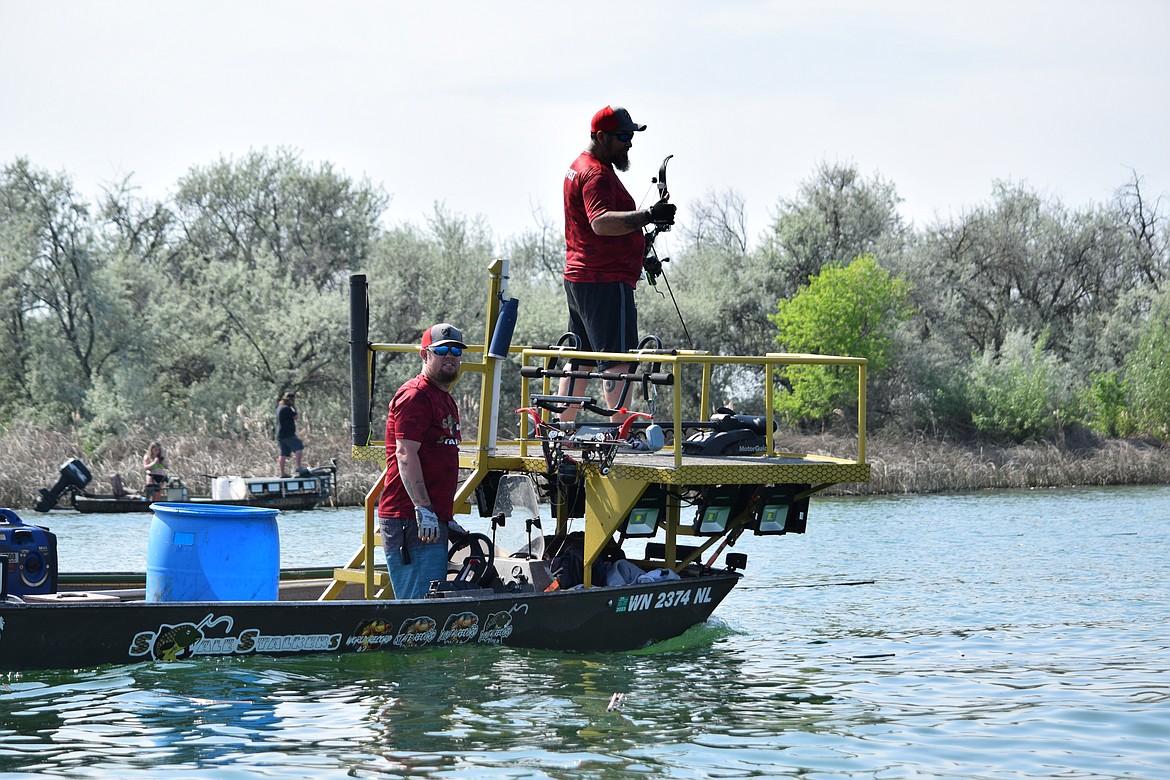 A pair of carp shooters on a specialized fish shooting boat during the Moses Lake Carp Classic on Saturday, May 20.