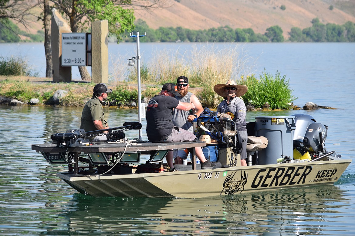 A carp shooting team returns to the boat launch at Connelly Park to weigh their catch at the end of the Moses Lake Carp Classic on Saturday, May 20.