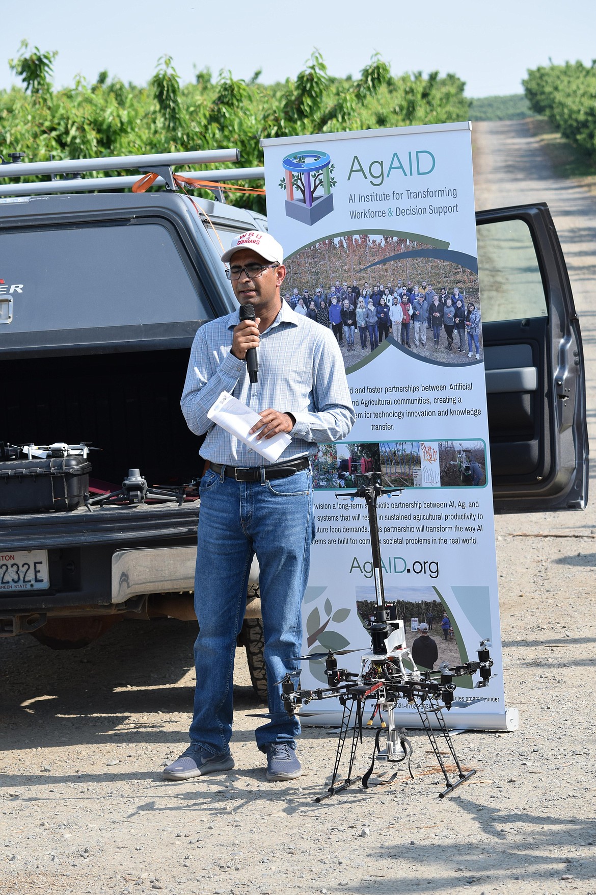 Lav Khot, director of Washington State University’s AgWeatherNet and a specialist in precision agriculture, stands next to a WSU drone during the Spring Drone Day demonstration near Pasco.
