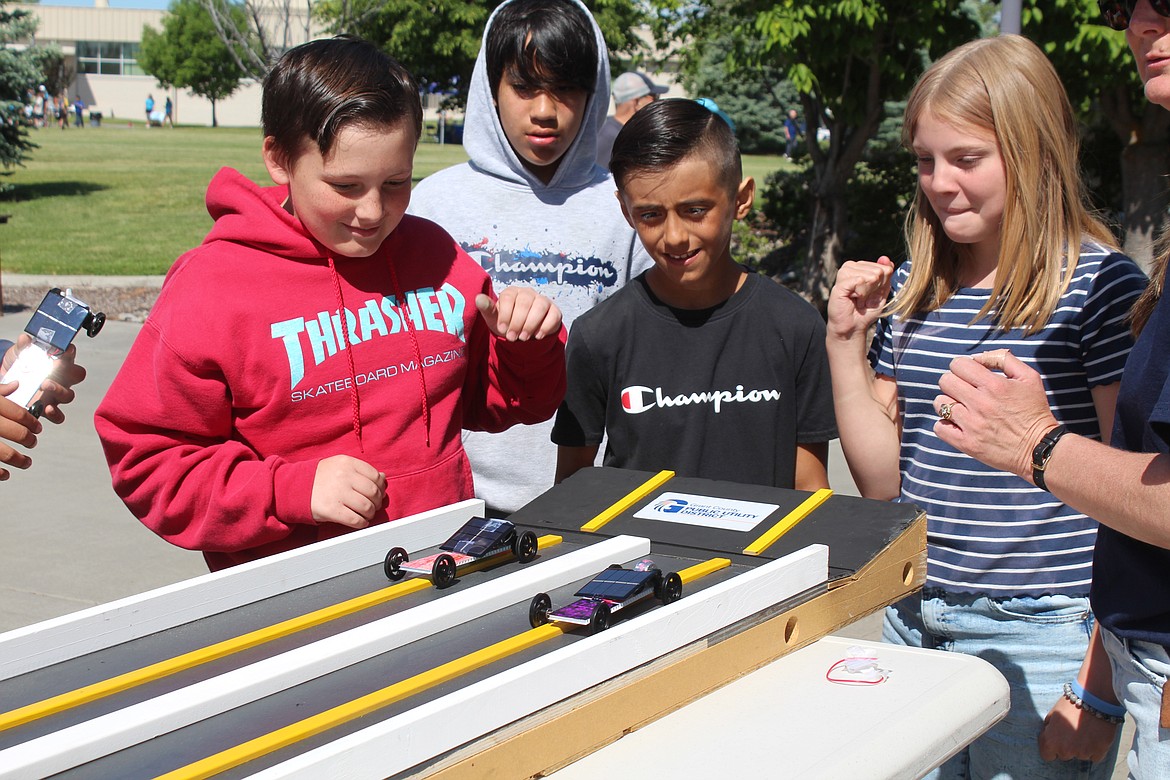 Fifth-grade car builders watch their machines leave the starting line at the annual Solar Car STEM day races Wednesday.