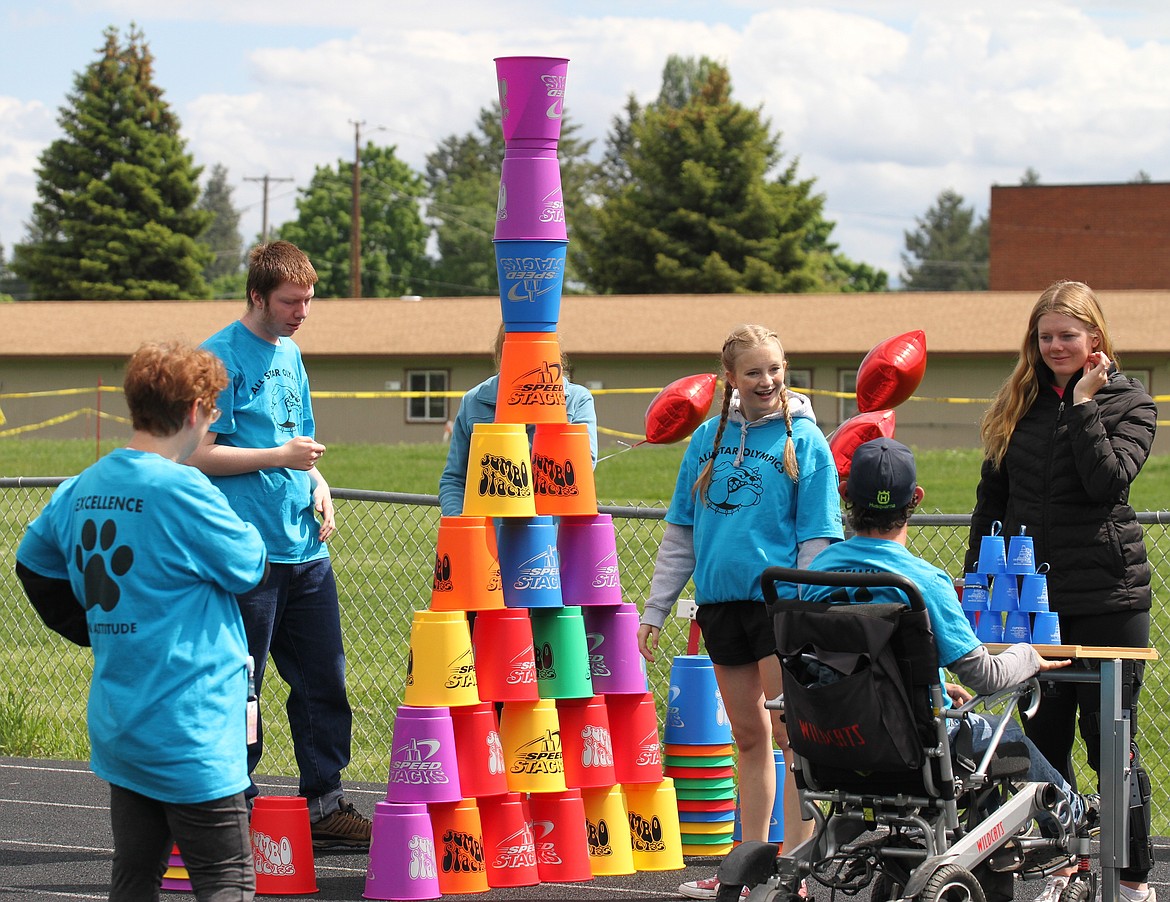 Students stack cups as high as they possibly can at the speed stacking station.