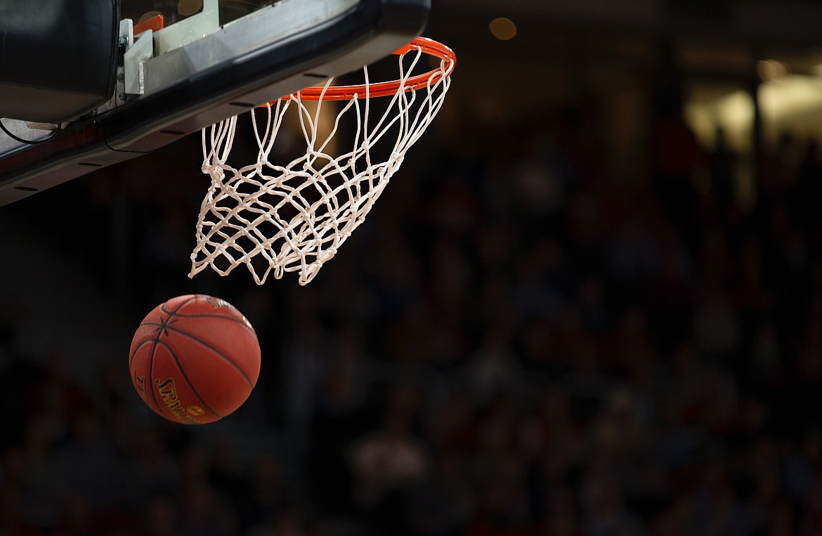 Stock photo of a basketball and hoop. (Unsplash)