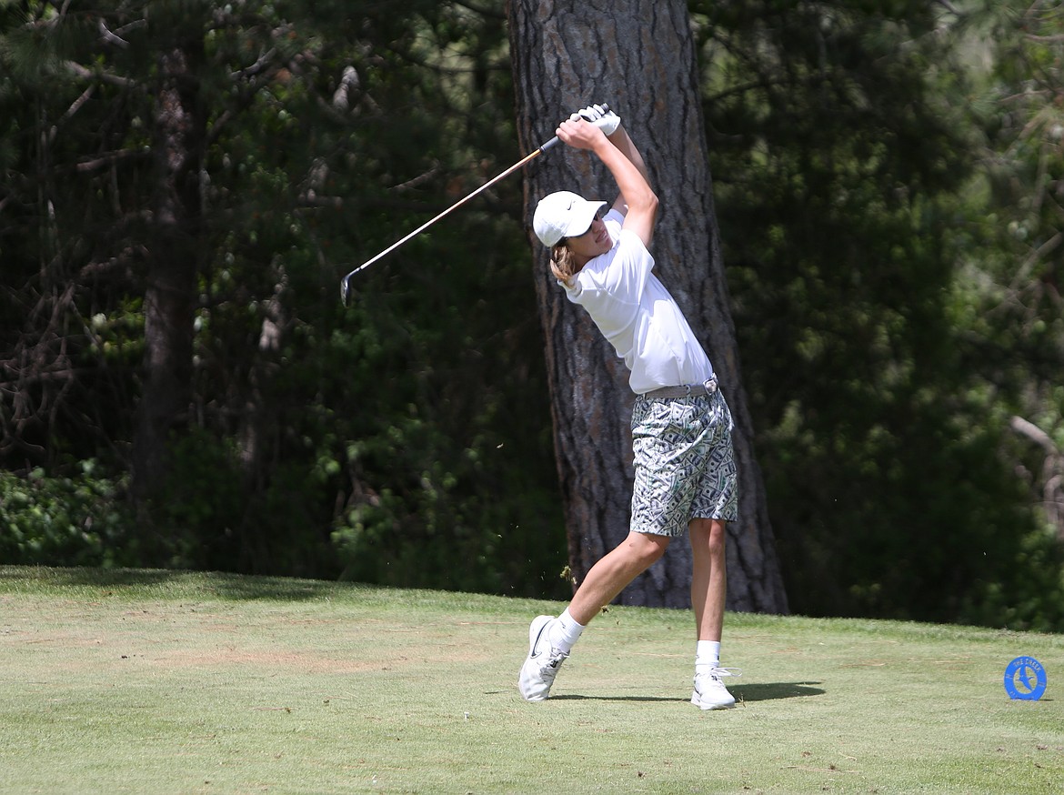 Moses Lake’s Quinten Whittall drives a ball at the fourth hole at the Qualchan Golf Course during the first round of the 4A State Boys Golf Tournament.
