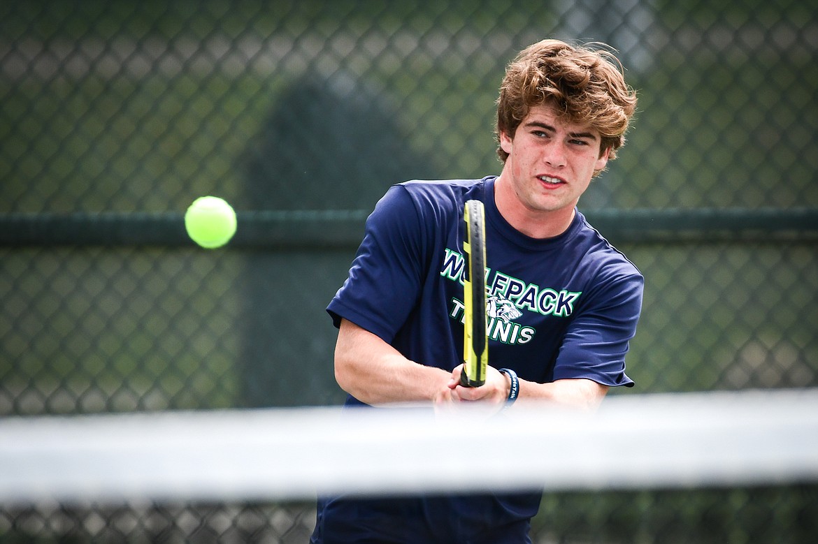 Glacier's Harrison Sanders hits a backhand return in the State AA boys doubles championship match with teammate Timmy Glanville against Gallatin's Brody Smith and Braeden Butler at Flathead Valley Community College on Friday, May 26. (Casey Kreider/Daily Inter Lake)