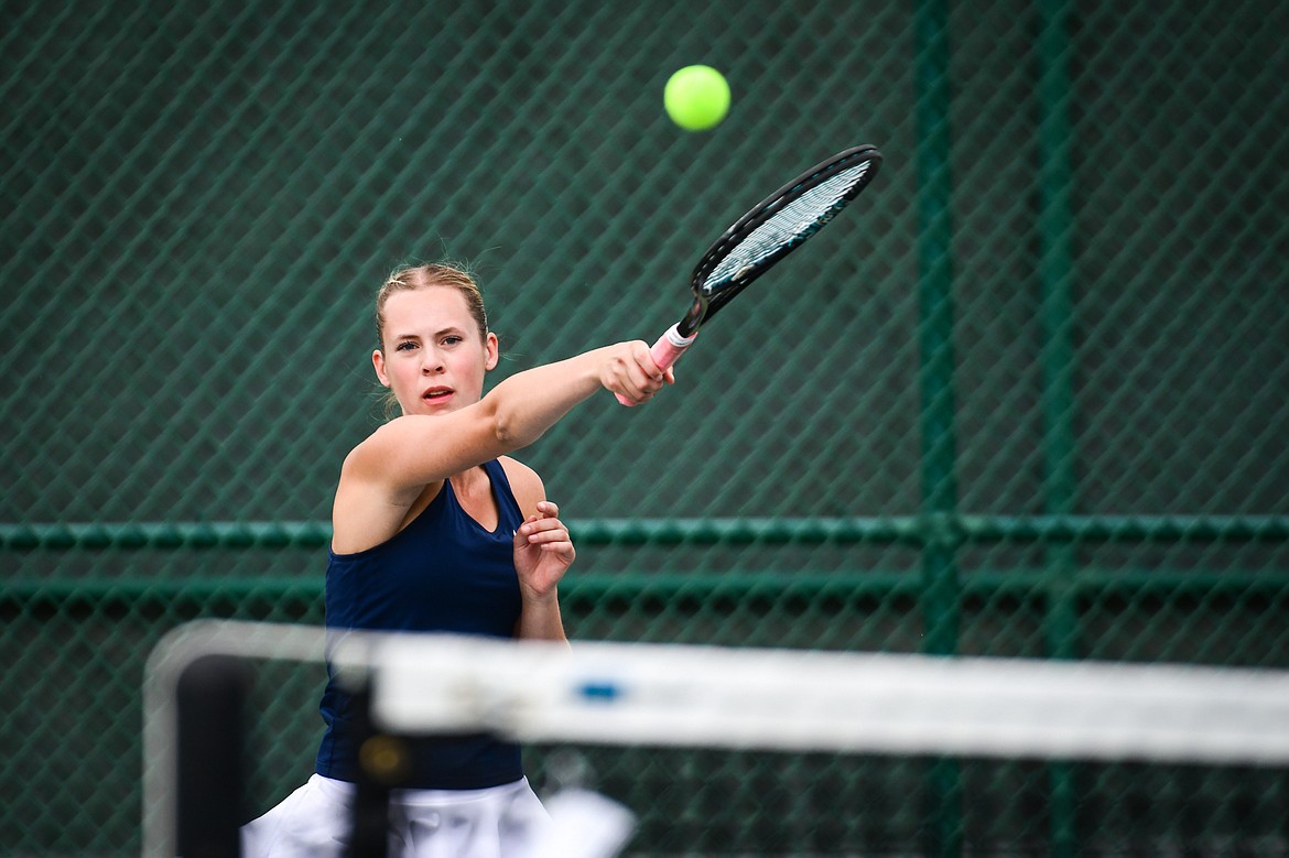 Glacier's Sarah Downs hits a return in the State AA girls doubles championship match with teammate Haven Speer against Missoula Hellgate's Laine Banziger and Brooke Best at Flathead Valley Community College on Friday, May 26. (Casey Kreider/Daily Inter Lake)