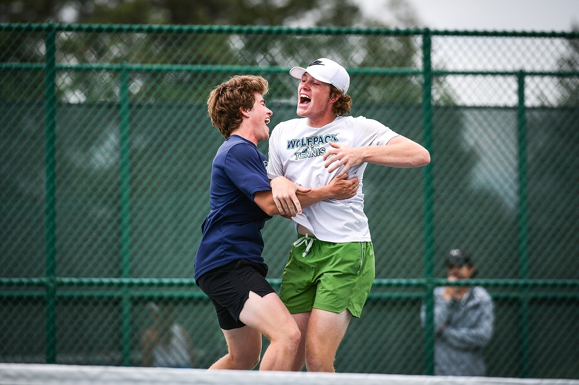 Glacier's Harrison Sanders, left, and Timmy Glanville celebrate after winning the State AA boys doubles championship over Gallatin's Brody Smith and Braeden Butler at Flathead Valley Community College on Friday, May 26. (Casey Kreider/Daily Inter Lake)