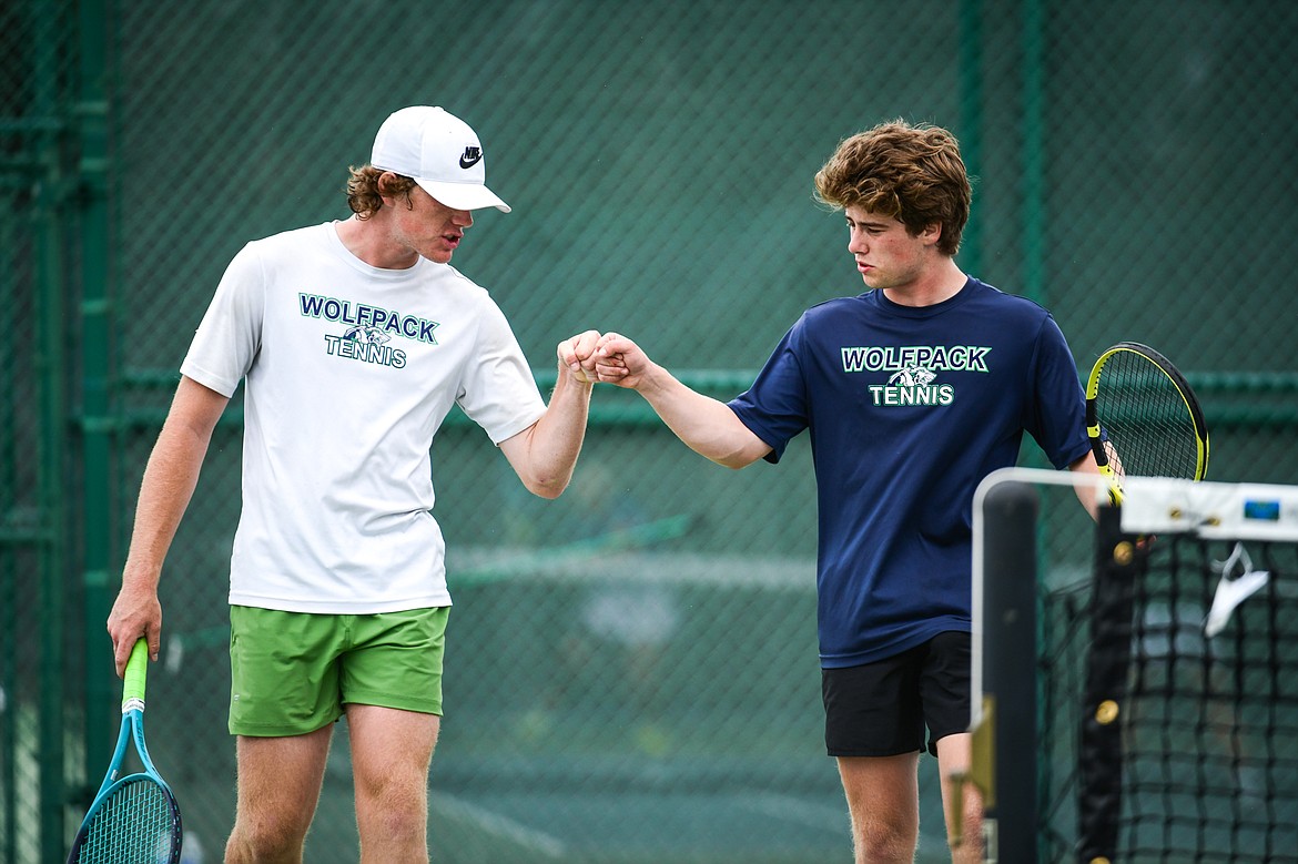 Glacier's Timmy Glanville and Harrison Sanders talk between sets during the State AA boys doubles championship against Gallatin's Brody Smith and Braeden Butler at Flathead Valley Community College on Friday, May 26. (Casey Kreider/Daily Inter Lake)