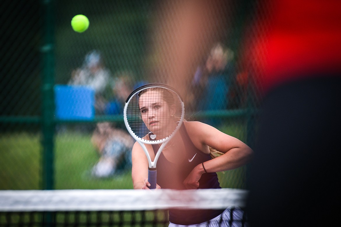 Glacier's Haven Speer hits a return in the State AA girls doubles championship match with teammate Sarah Downs against Missoula Hellgate's Laine Banziger and Brooke Best at Flathead Valley Community College on Friday, May 26. (Casey Kreider/Daily Inter Lake)