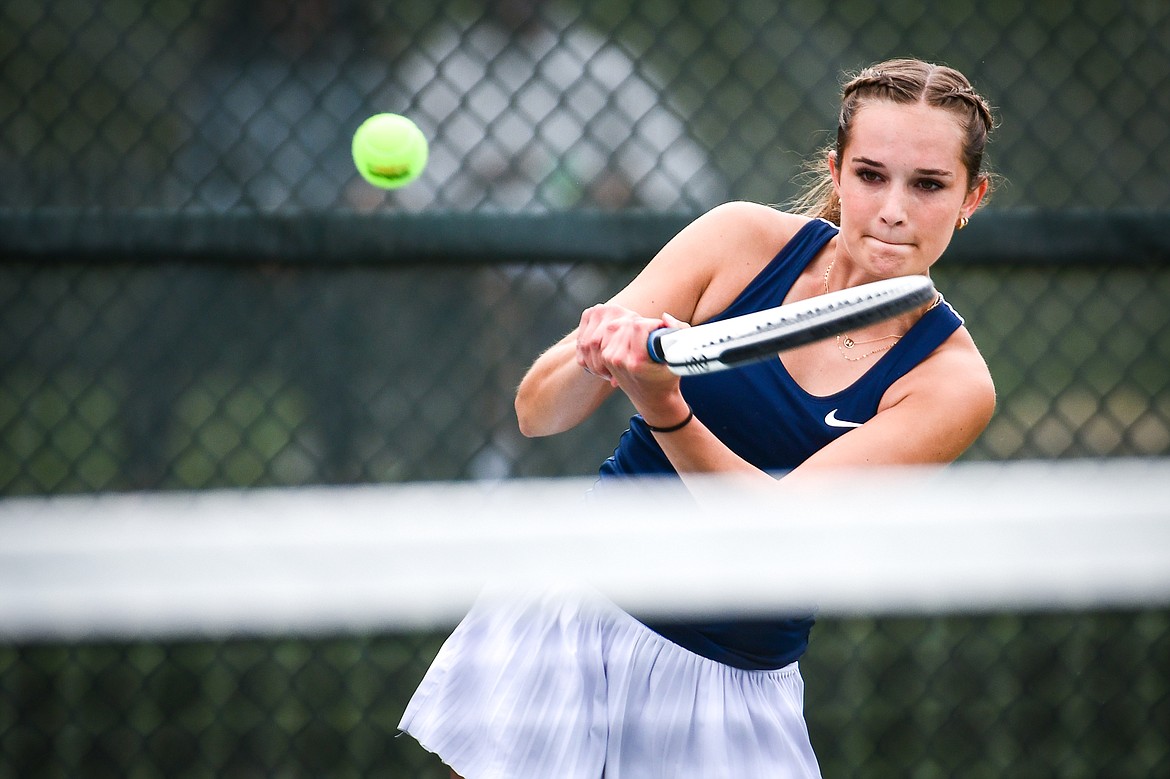 Glacier's Haven Speer hits a backhand return in the State AA girls doubles championship match with teammate Sarah Downs against Missoula Hellgate's Laine Banziger and Brooke Best at Flathead Valley Community College on Friday, May 26. (Casey Kreider/Daily Inter Lake)