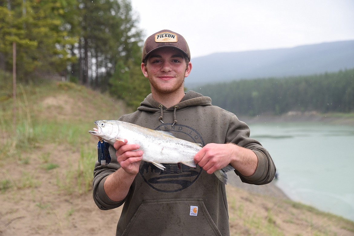 Isaiah McCall shows off a 2.4 pound rainbow trout he caught during the Lake Koocanusa Fishing Derby on the weekend of May 20-21. McCall lives in Spokane, but he is a native of Ronan, Montana. (Scott Shindledecker/The Western News)
