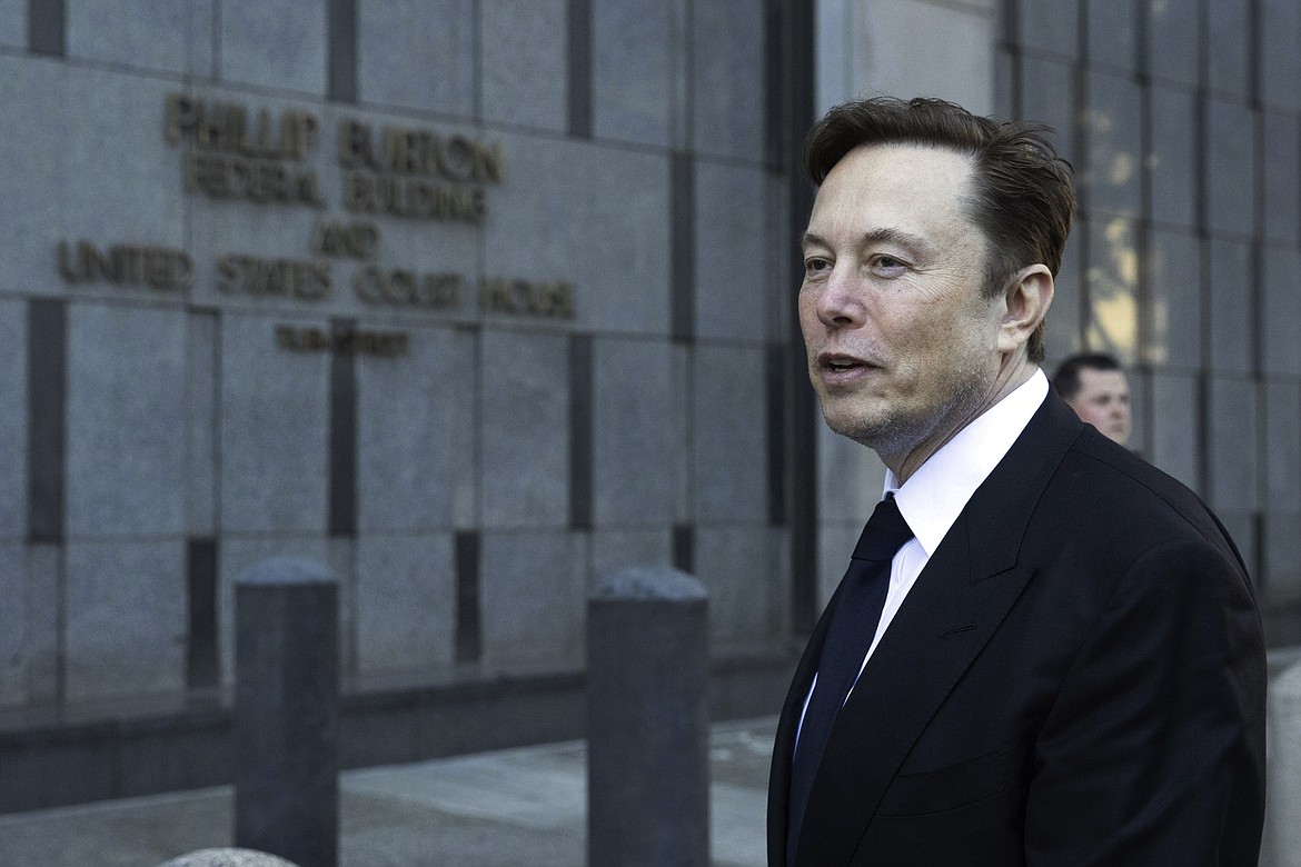 FILE - Elon Musk departs the Phillip Burton Federal Building and United States Court House in San Francisco, on Tuesday, Jan. 24, 2023. Musk’s brain implant company Neuralink says it’s gotten permission to begin testing its device in people.The company made the announcement on Twitter Thursday, May 25, but has provided no details about a potential trial, which was not listed on the U.S. government database of trials. (AP Photo/ Benjamin Fanjoy, File)