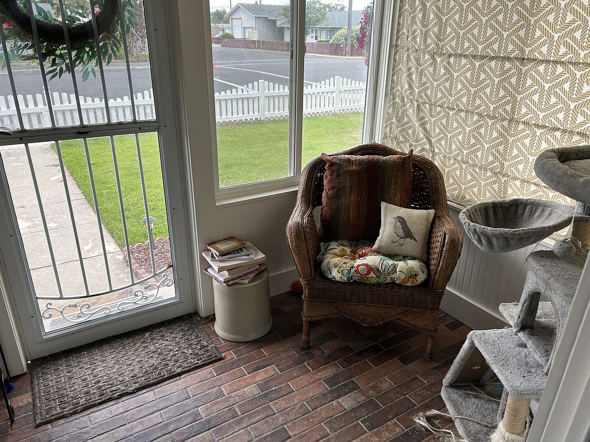 Clients at The Massage Cottage can relax in the massage studio's waiting area where they may run into one of the business's two resident cats.