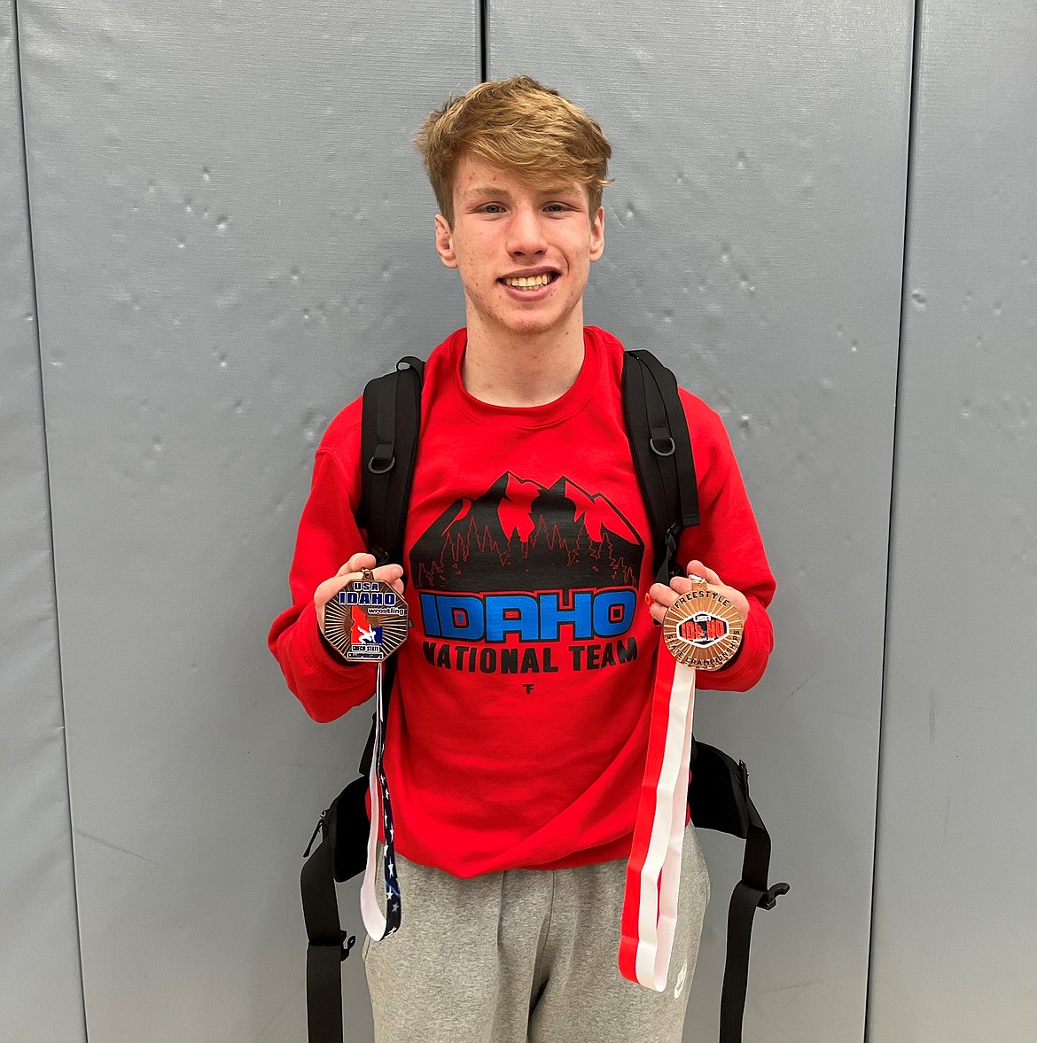 Shane Sherrill poses with his medals at the Idaho Freestyle and Greco State Championship in Twin Falls.