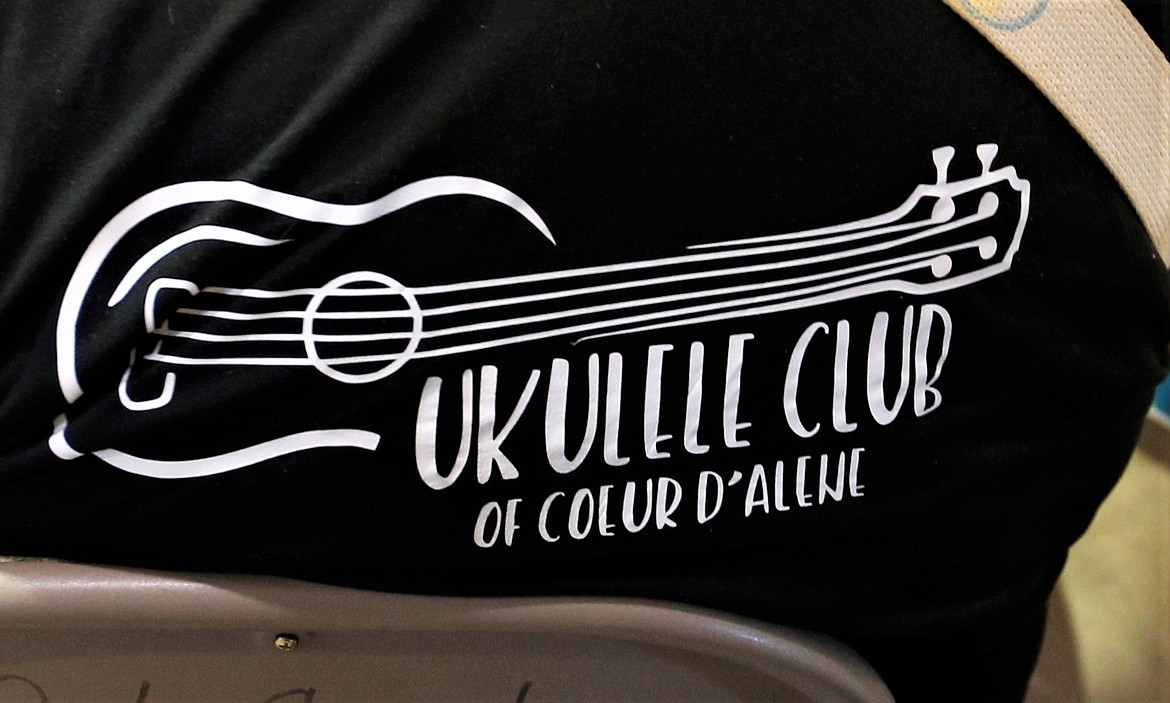 A member wears a T-shirt of the Ukulele Club of Coeur d'Alene.