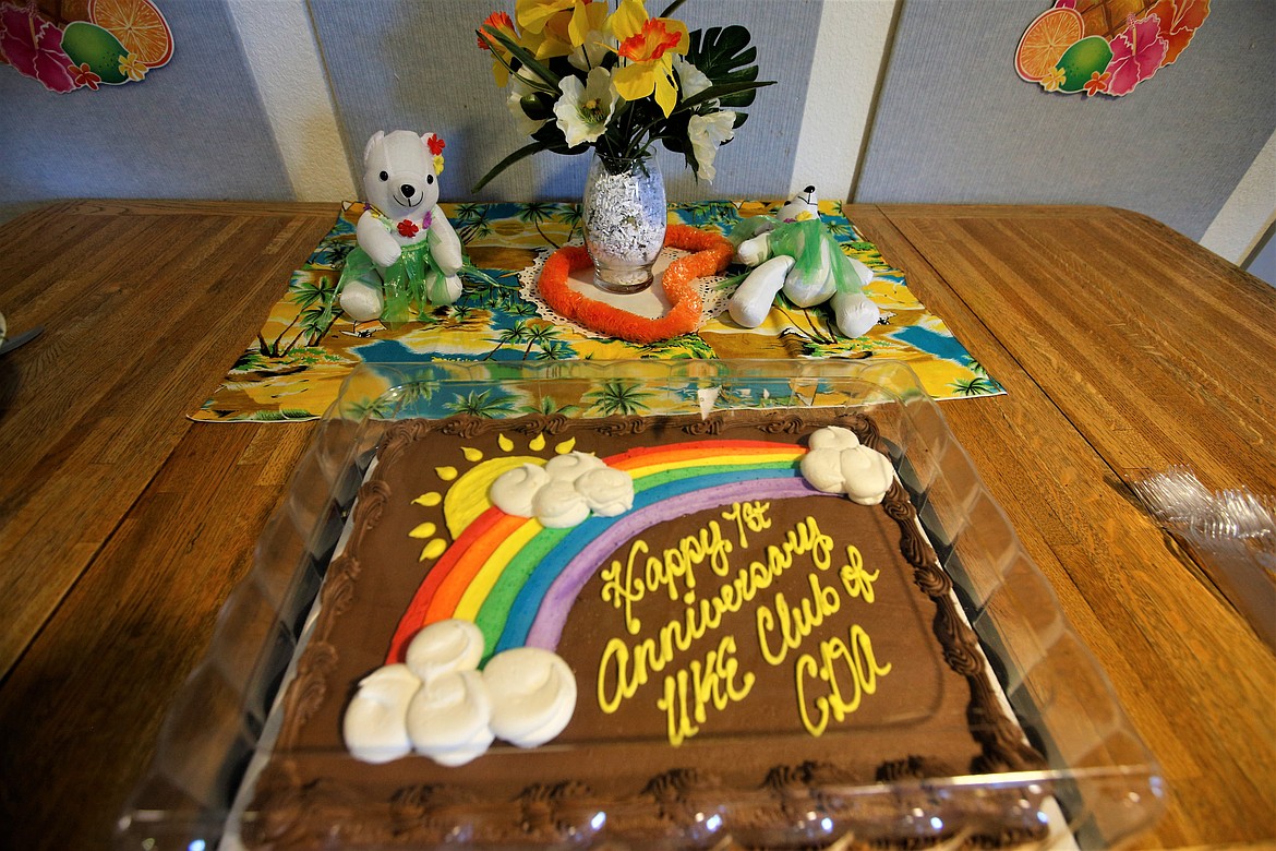 A decorated cake sits on a table at the first-anniversary party of the Ukulele Club of Coeur d'Alene.
