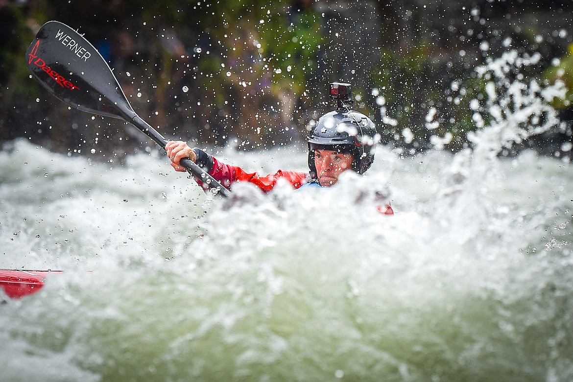 A kayaker navigates a section of the Wild Mile along the Swan River during the Expert Slalom event at the 48th annual Bigfork Whitewater Festival on Saturday, May 27. (Casey Kreider/Daily Inter Lake)