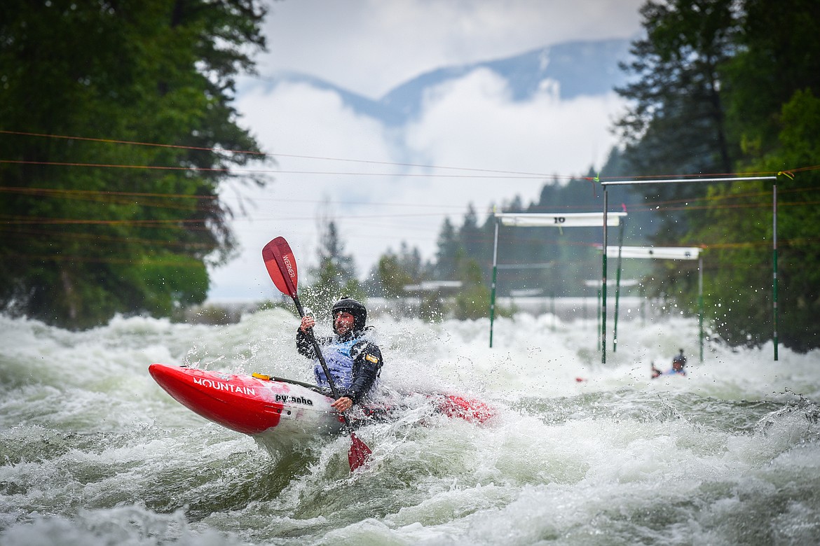 A kayaker navigates a section of the Wild Mile along the Swan River during the Expert Slalom event at the 48th annual Bigfork Whitewater Festival on Saturday, May 27. (Casey Kreider/Daily Inter Lake)