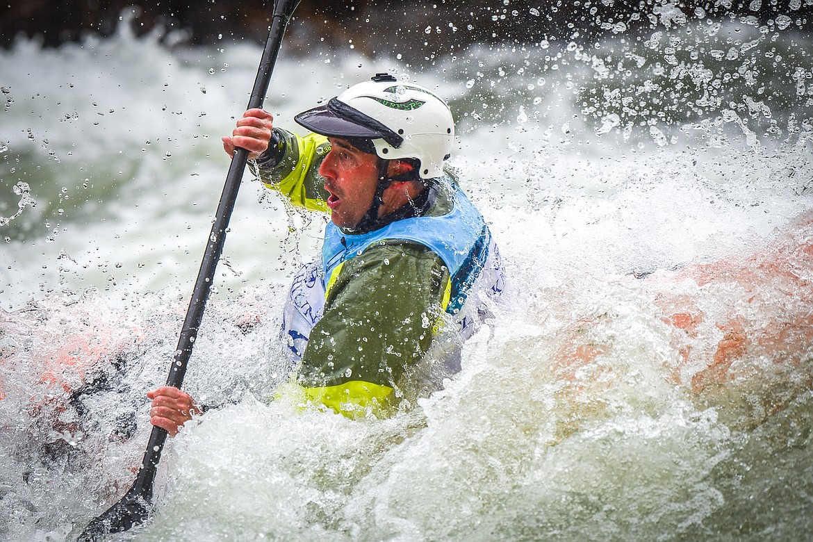 A kayaker navigates a section of the Wild Mile along the Swan River during the Expert Slalom event at the 48th annual Bigfork Whitewater Festival on Saturday, May 27. (Casey Kreider/Daily Inter Lake)