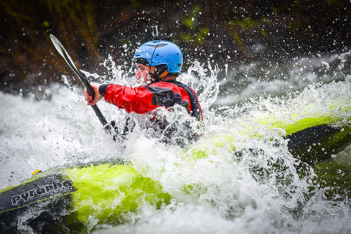 A kayaker navigates a section of the Wild Mile along the Swan River during the Expert Slalom event at the 48th annual Bigfork Whitewater Festival on Saturday, May 27. (Casey Kreider/Daily Inter Lake)