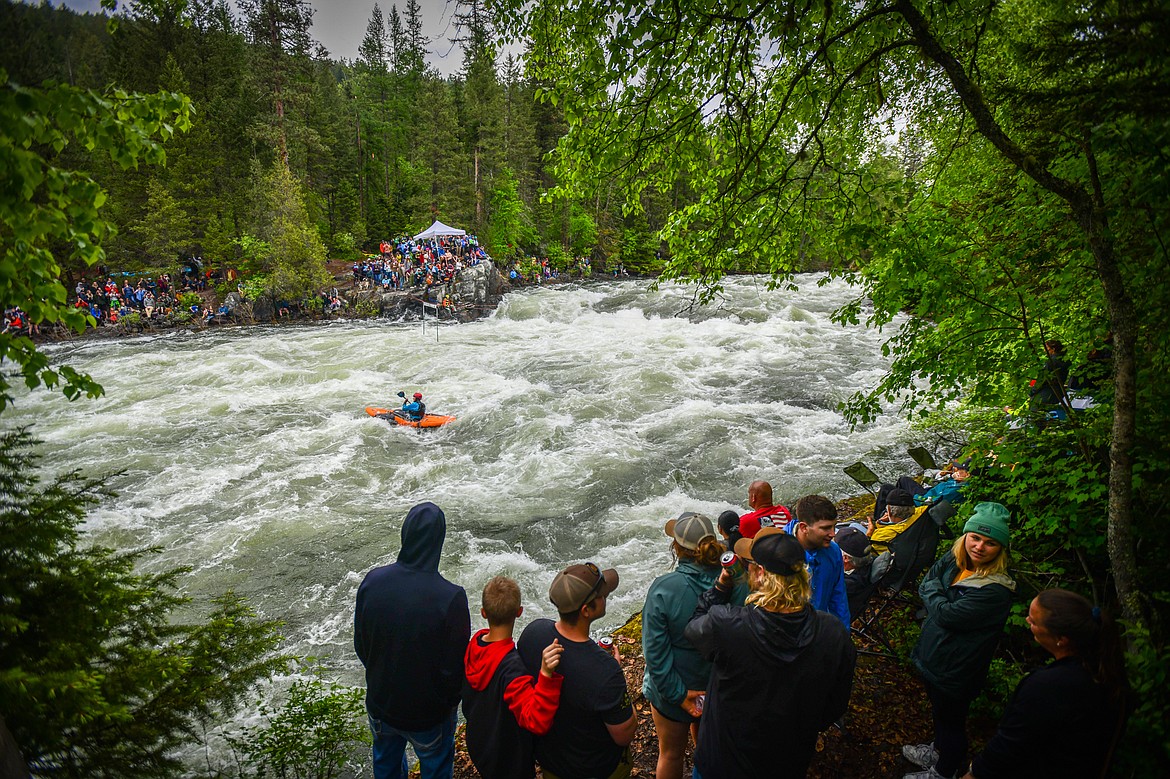 Spectators watch as kayakers navigate a section of the Wild Mile along the Swan River during the Expert Slalom event at the 47th annual Bigfork Whitewater Festival on Saturday, May 28. (Casey Kreider/Daily Inter Lake)