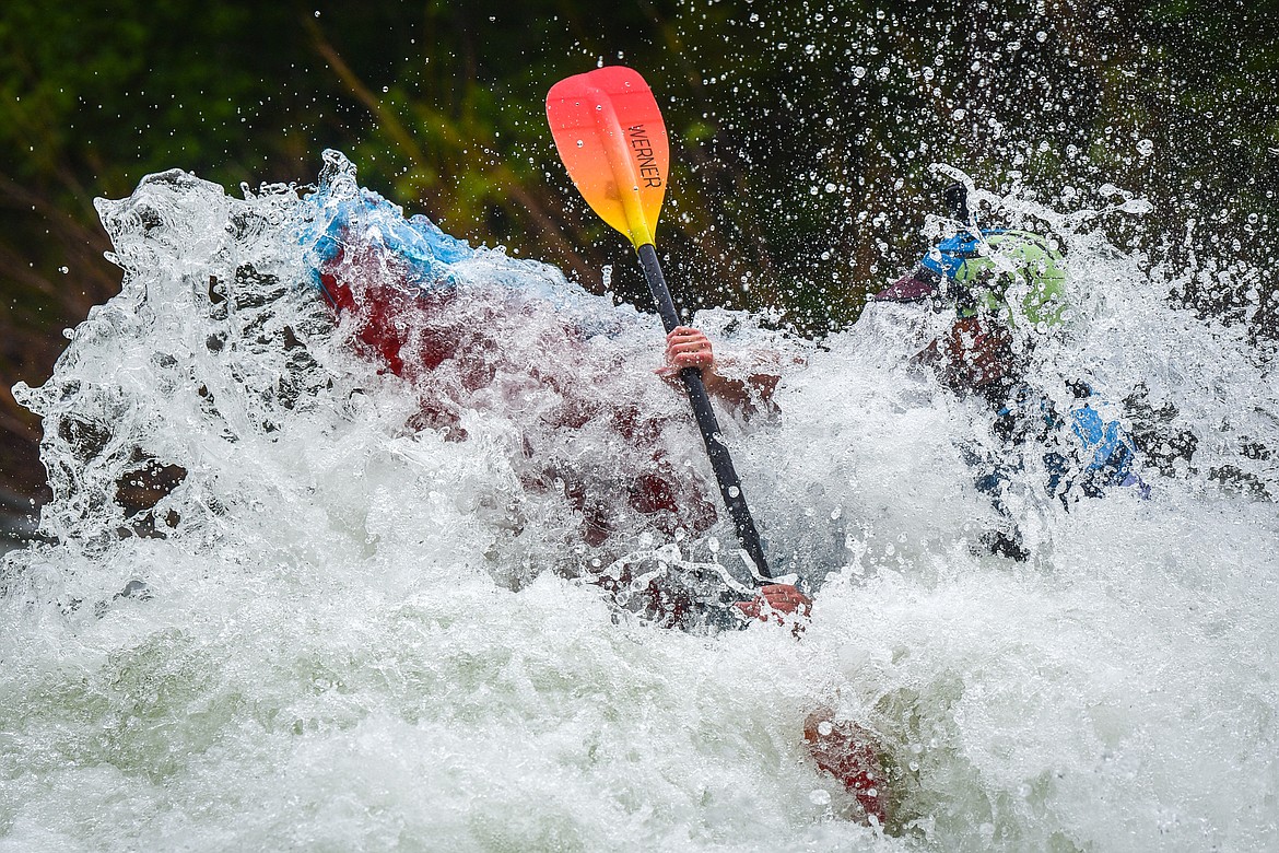 A kayaker navigates a section of the Wild Mile along the Swan River during the Expert Slalom event at the 48th annual Bigfork Whitewater Festival on Saturday, May 27. (Casey Kreider/Daily Inter Lake)