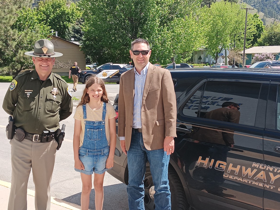 Steve Lavine, Chief of the Montana Highway Patrol, and Attorney General Austin Knudsen made a special trip to Superior to award fifth-grade student Madisyn Allard her winning certificate in this year’s Montana Law Enforcement Appreciation Poster Contest. (Monte Turner/Mineral Independent)